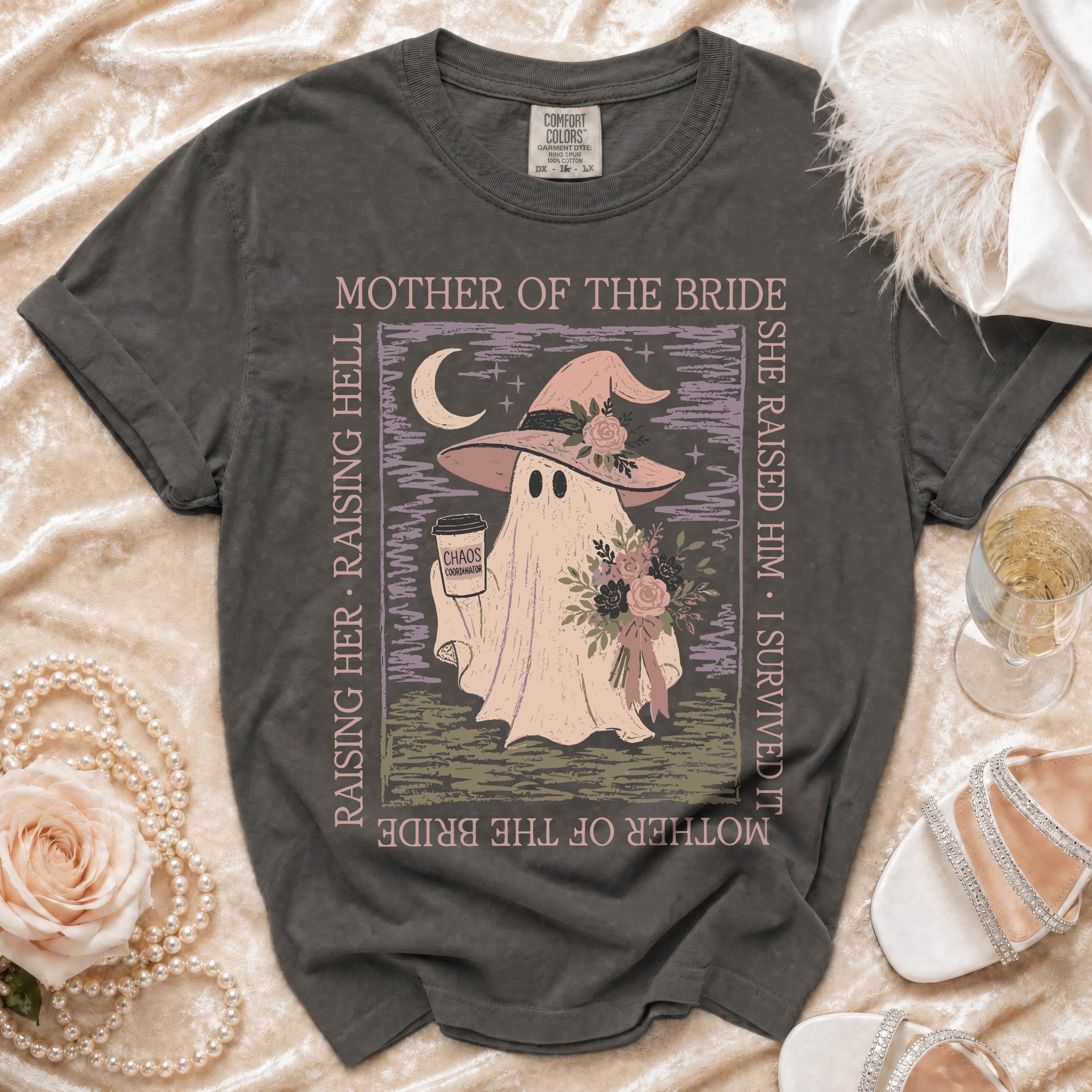 Dark gray t-shirt with ghost graphic and text "Mother of the Bride" and "Chaos Coordinator".