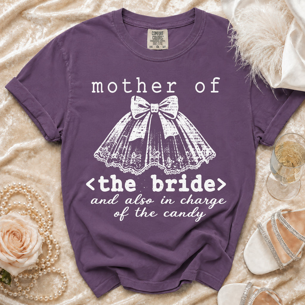 Purple t-shirt reads "mother of <the bride> and also in charge of the candy".