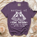 Purple t-shirt reads "mother of <the bride> and also in charge of the candy".