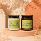 Two candles with labels reading "The people who showed up" by Vowed.