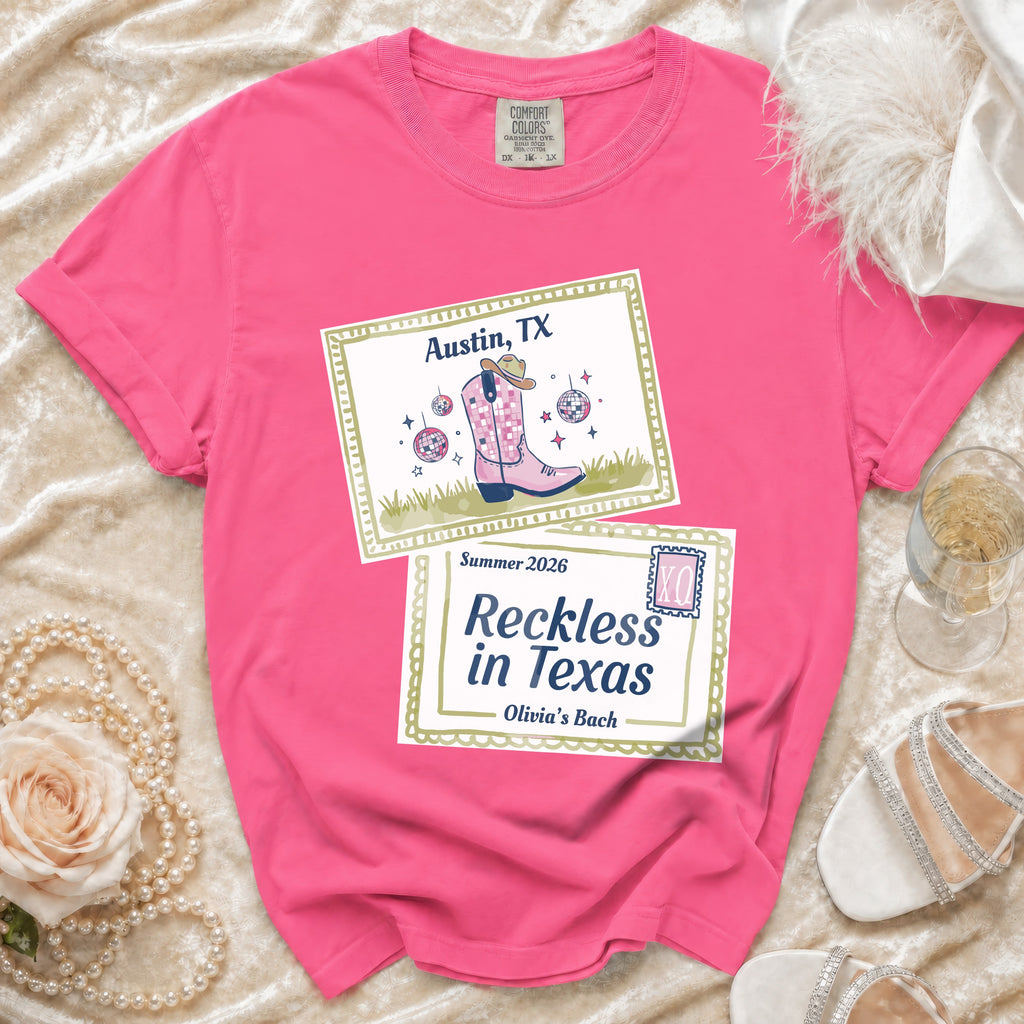 Pink t-shirt with "Austin, TX" and "Reckless in Texas Olivia's Bach" designs.