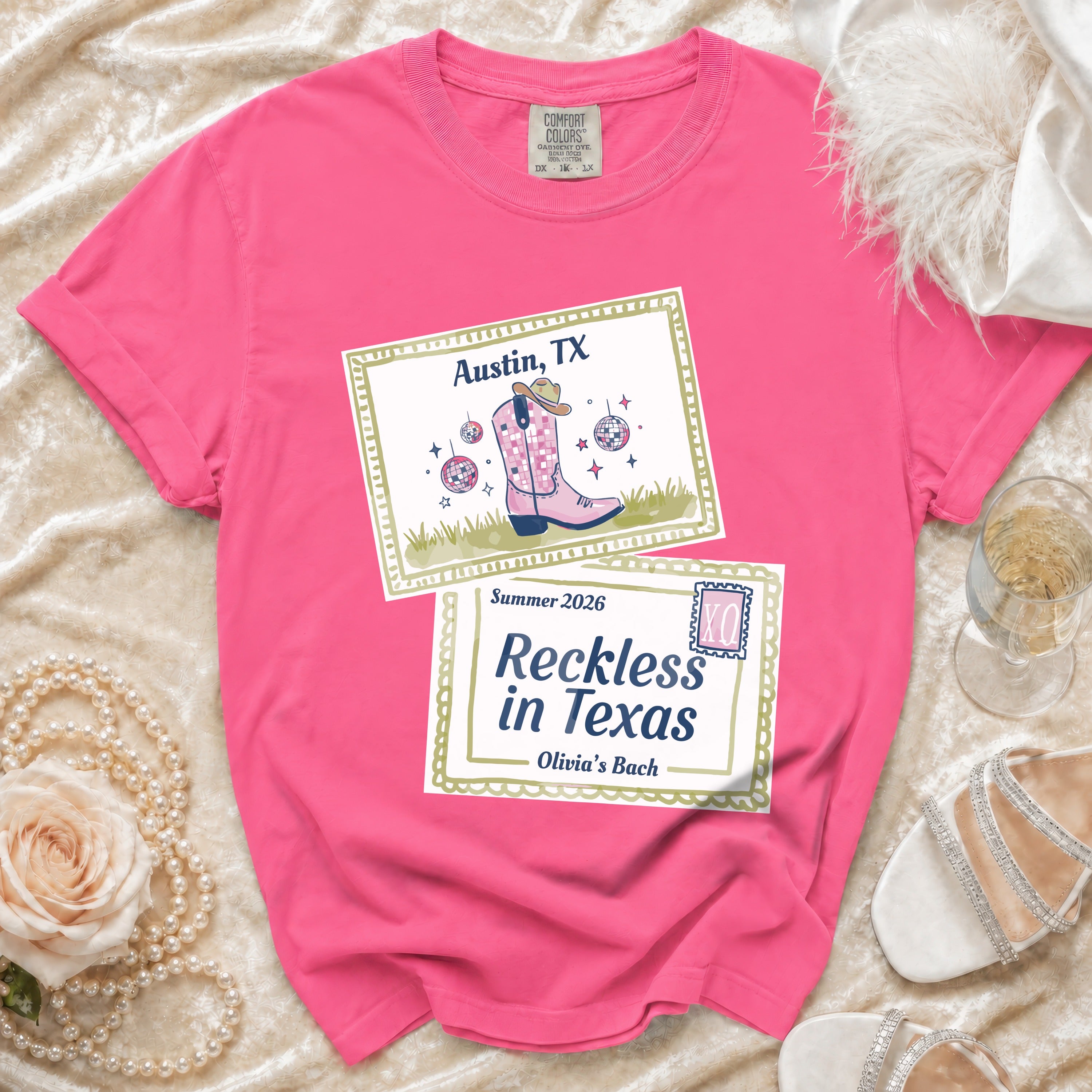 Pink t-shirt with "Austin, TX" and "Reckless in Texas Olivia's Bach" designs.