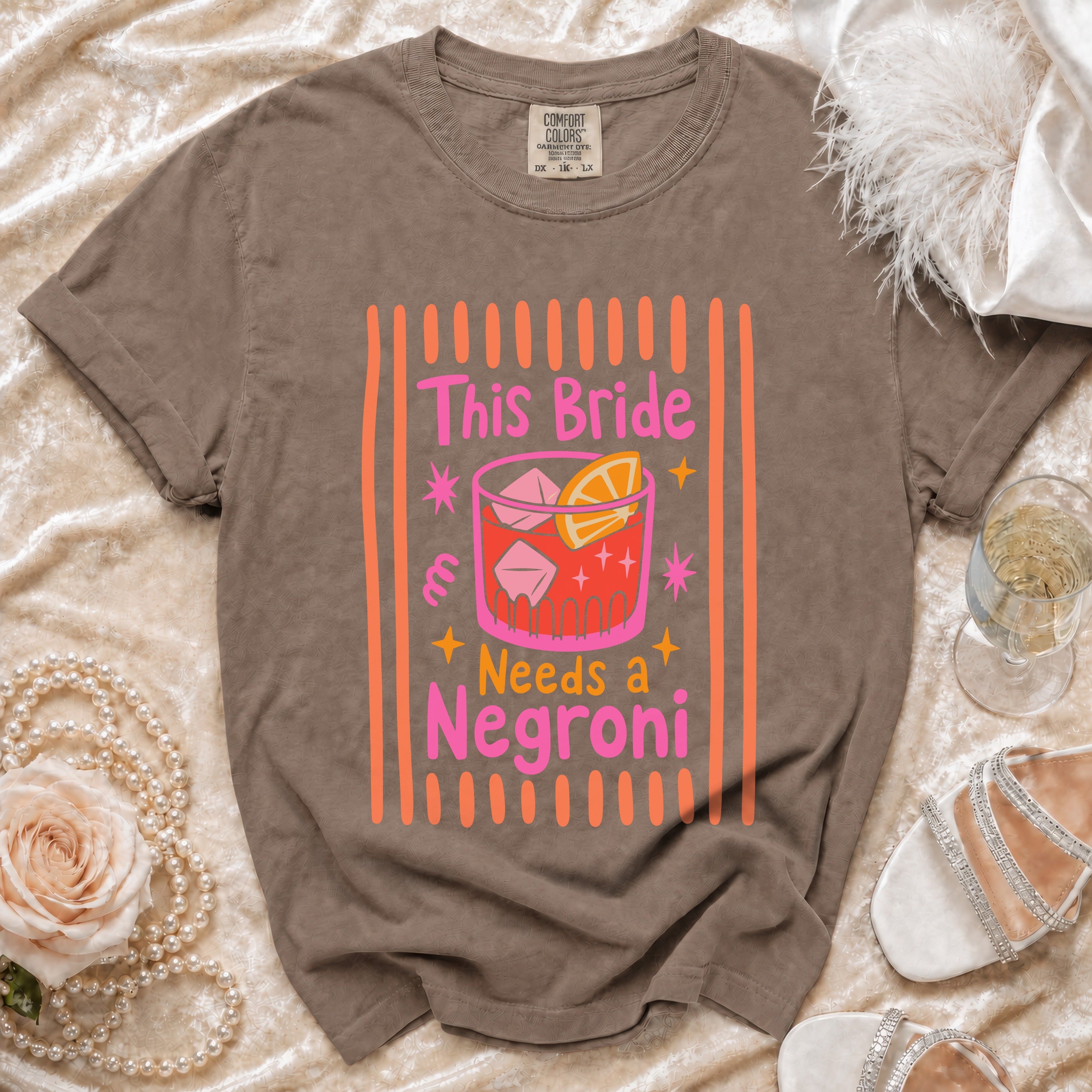 T-shirt with "This Bride Needs a Negroni" text inside a cocktail glass graphic.