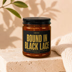 Amber jar with black lid and label reading "SWORN: BOUND IN BLACK LACE AND NOT LOOKING FOR A WAY OUT VOWED".