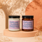 Two candles with "Officially Engaged Married" text on pink labels.