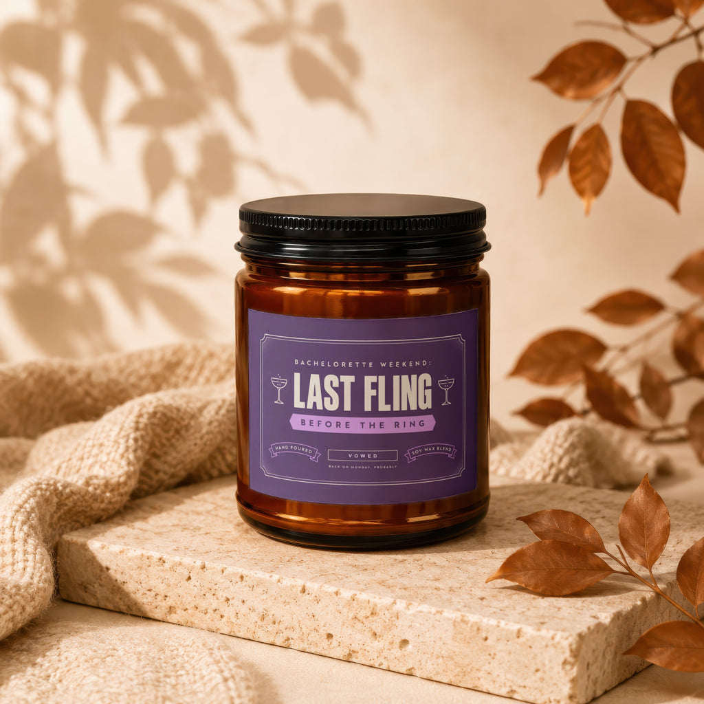 Amber candle with purple label reading "Last Fling Before the Ring."