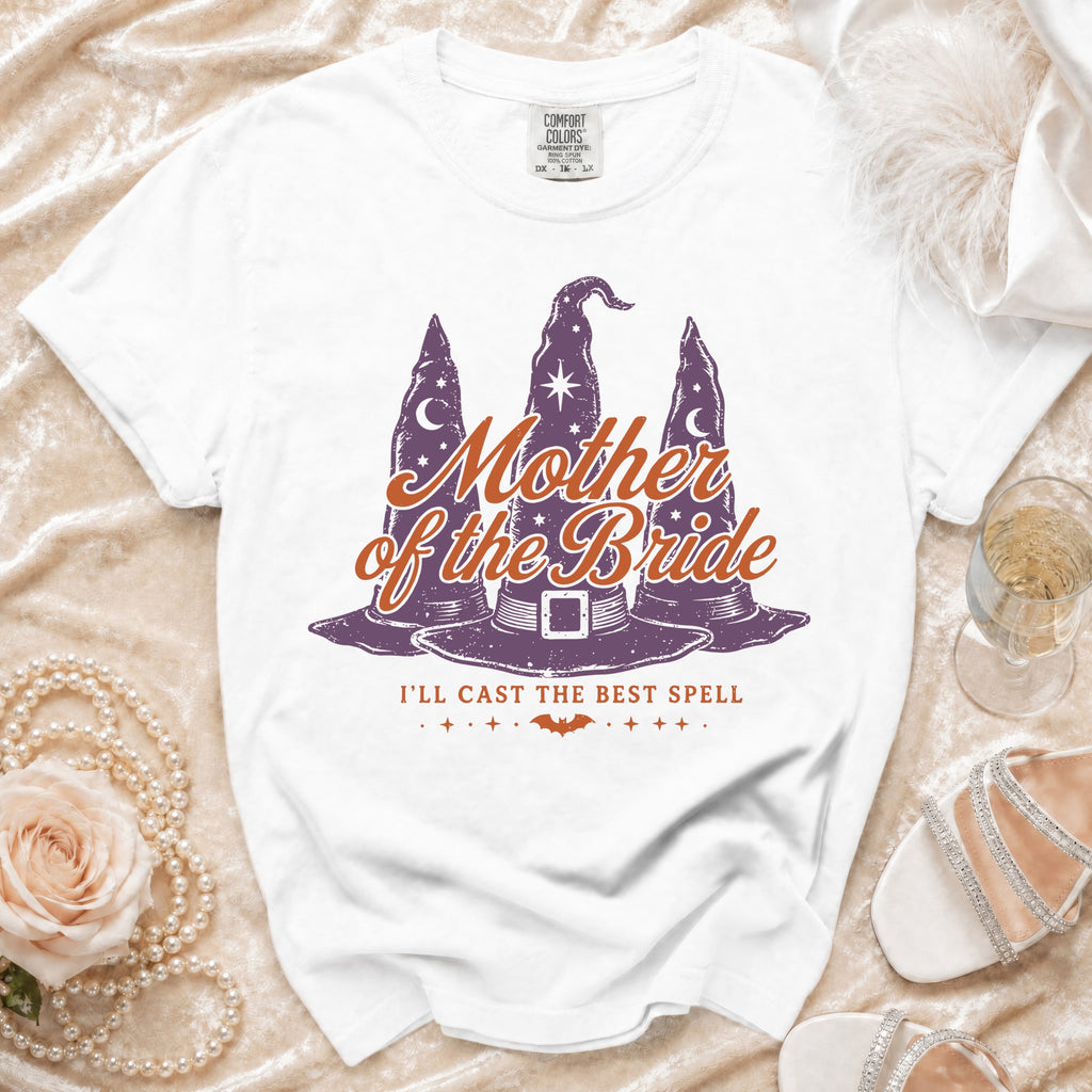 White t-shirt with "Mother of the Bride" and witch hats graphic.