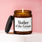 Amber glass candle with lit wick and "Mother of the Groom" text.