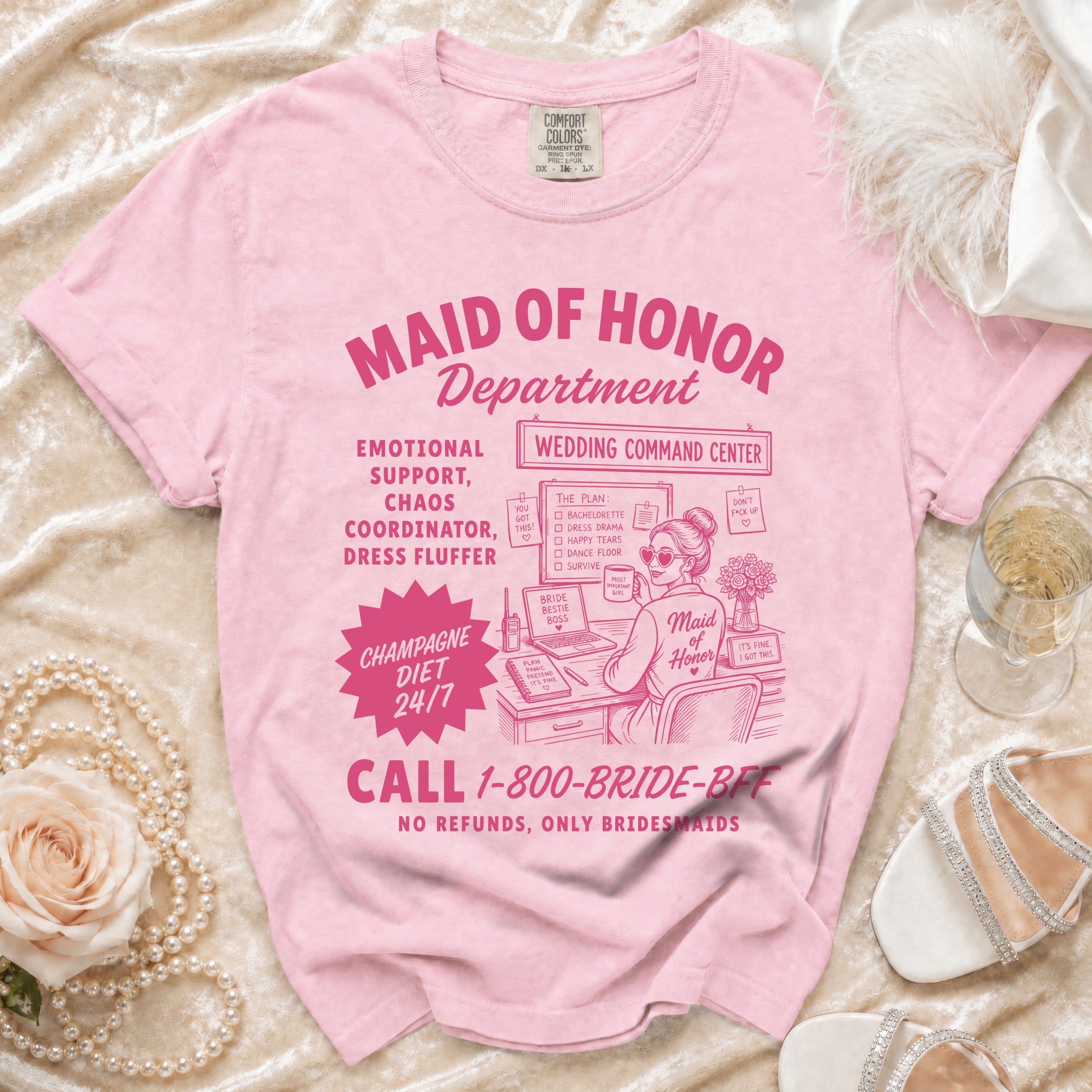 Pink t-shirt with "Maid of Honor Department" graphic and wedding-related text.