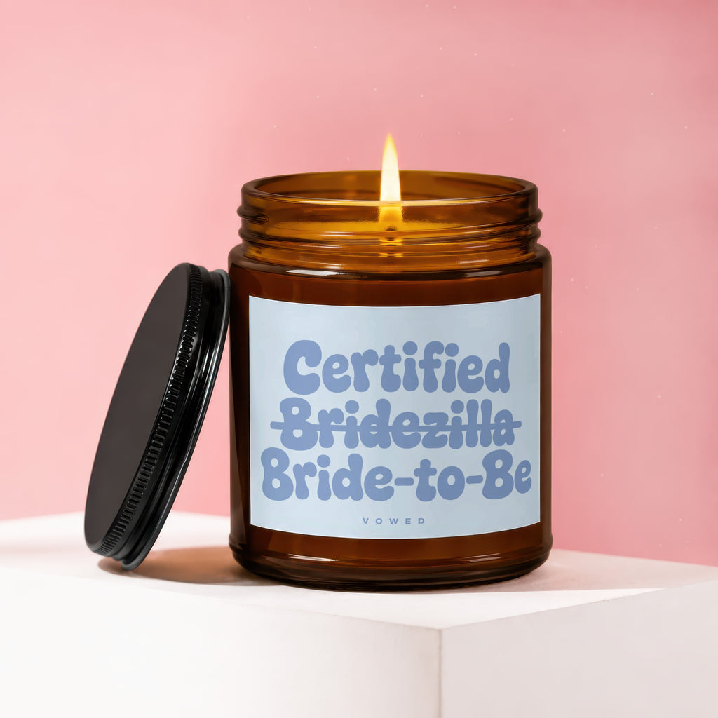 Amber candle with a lit wick and "Certified Bridezilla Bride-to-Be" label.
