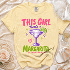 Yellow t-shirt with "This Girl Needs a Margarita" graphic and a margarita glass.