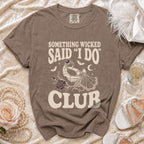 T-shirt with text "Something Wicked Said 'I Do' Club" and skeletal hand holding ring.
