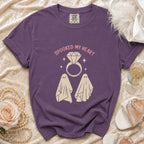 Purple t-shirt with "Spooked My Heart" text and two ghosts and ring graphic.