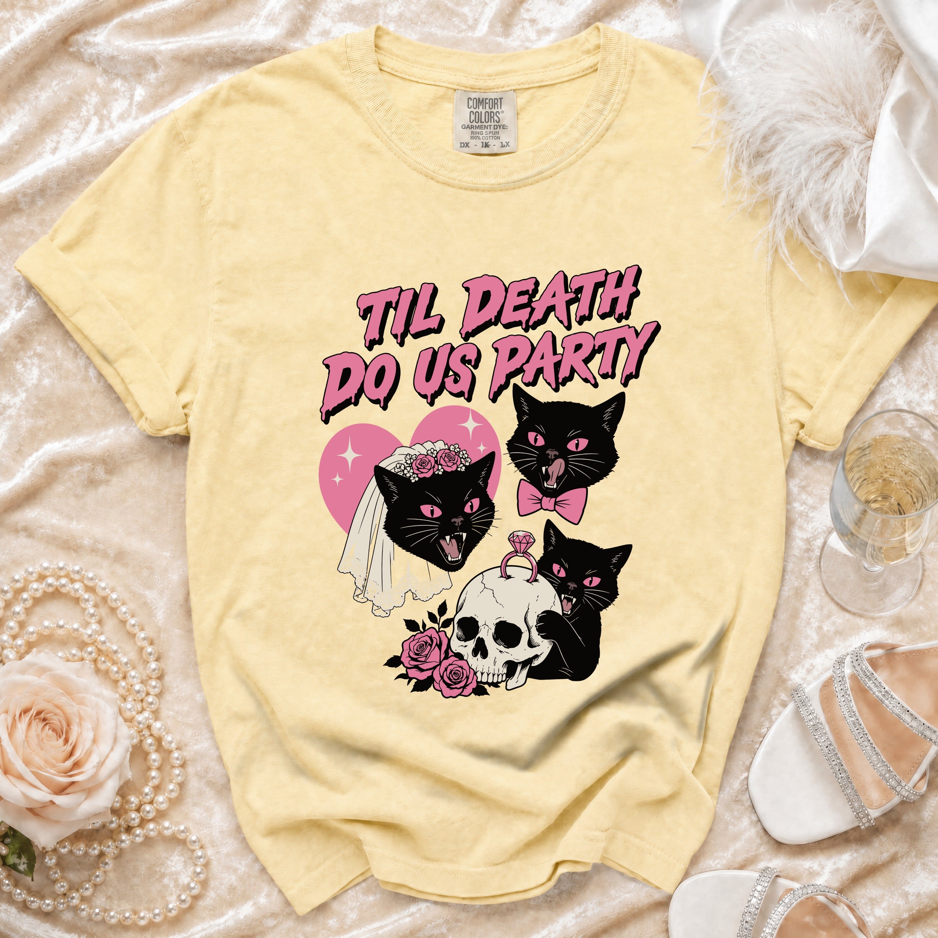 Yellow t-shirt with pink text "Til Death Do Us Party" and black cat illustrations.