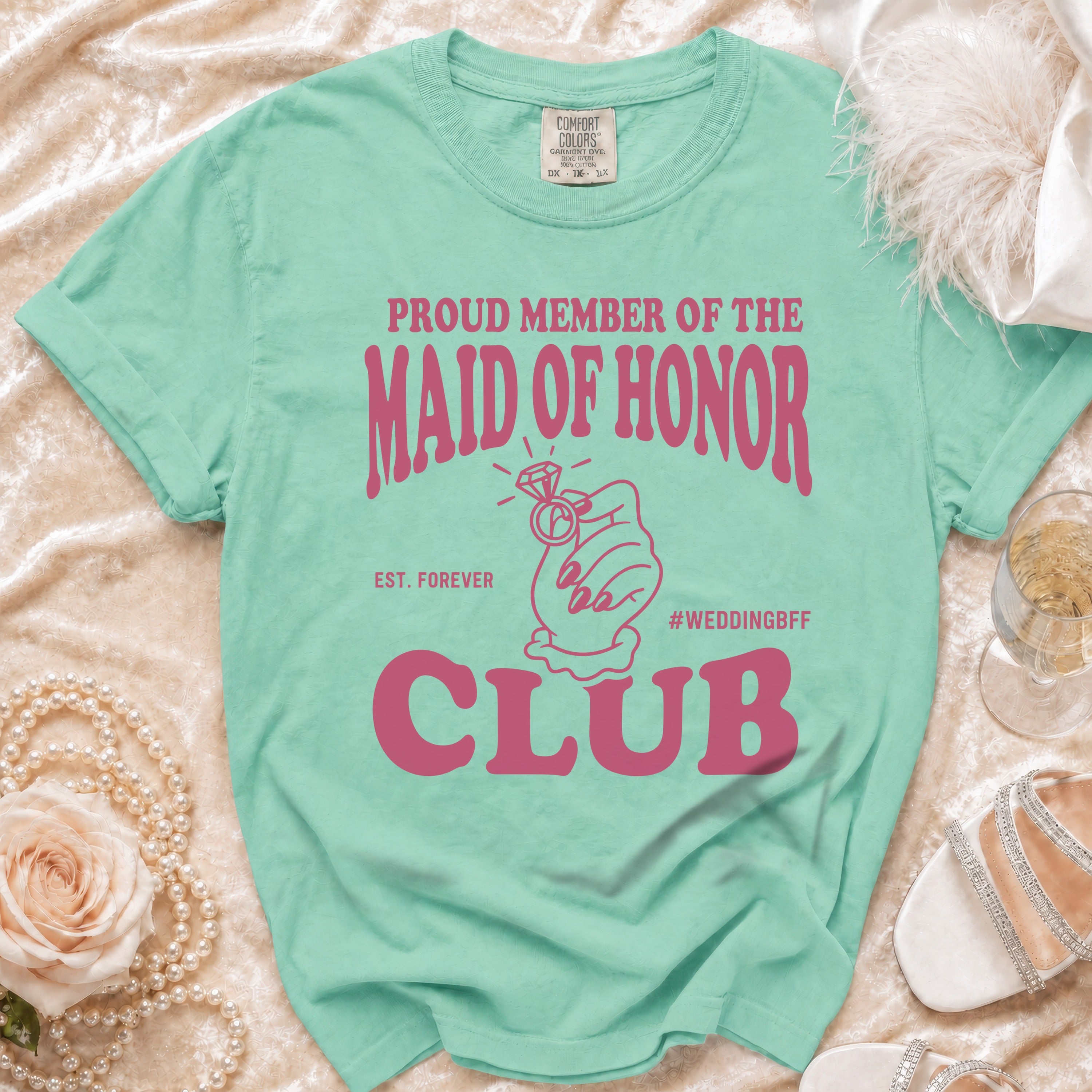 Mint green t-shirt reads "Proud Member of the Maid of Honor Club".