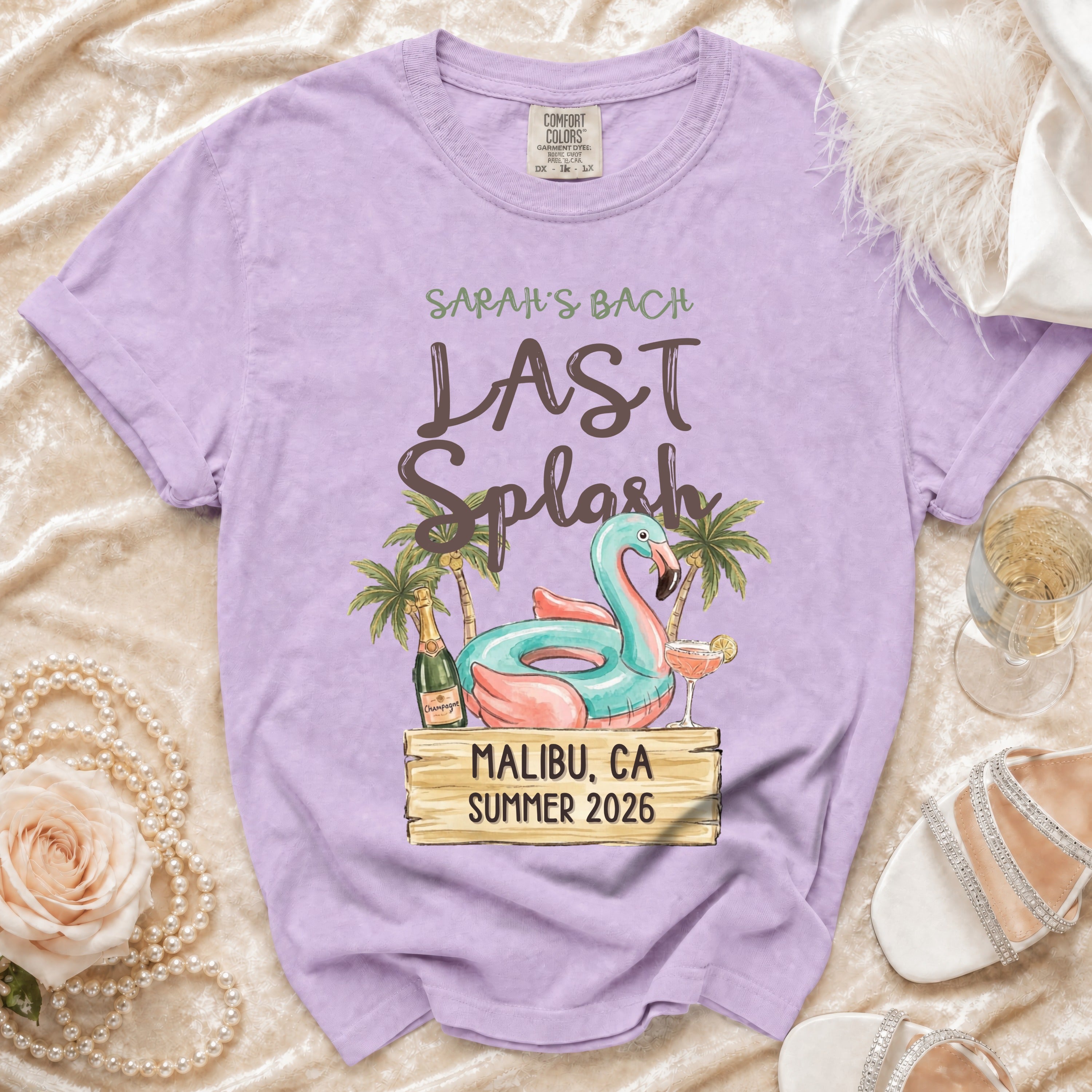 Purple t-shirt with "Sarah's Last Splash" text and Malibuca Summer 2026 graphic.