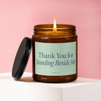 Candle with lit wick, reading "Thank You for Standing Beside Me" and "vowed".