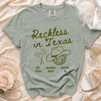 Comfort Colors t-shirt with "Reckless in Texas" graphic and Austin, TX details.
