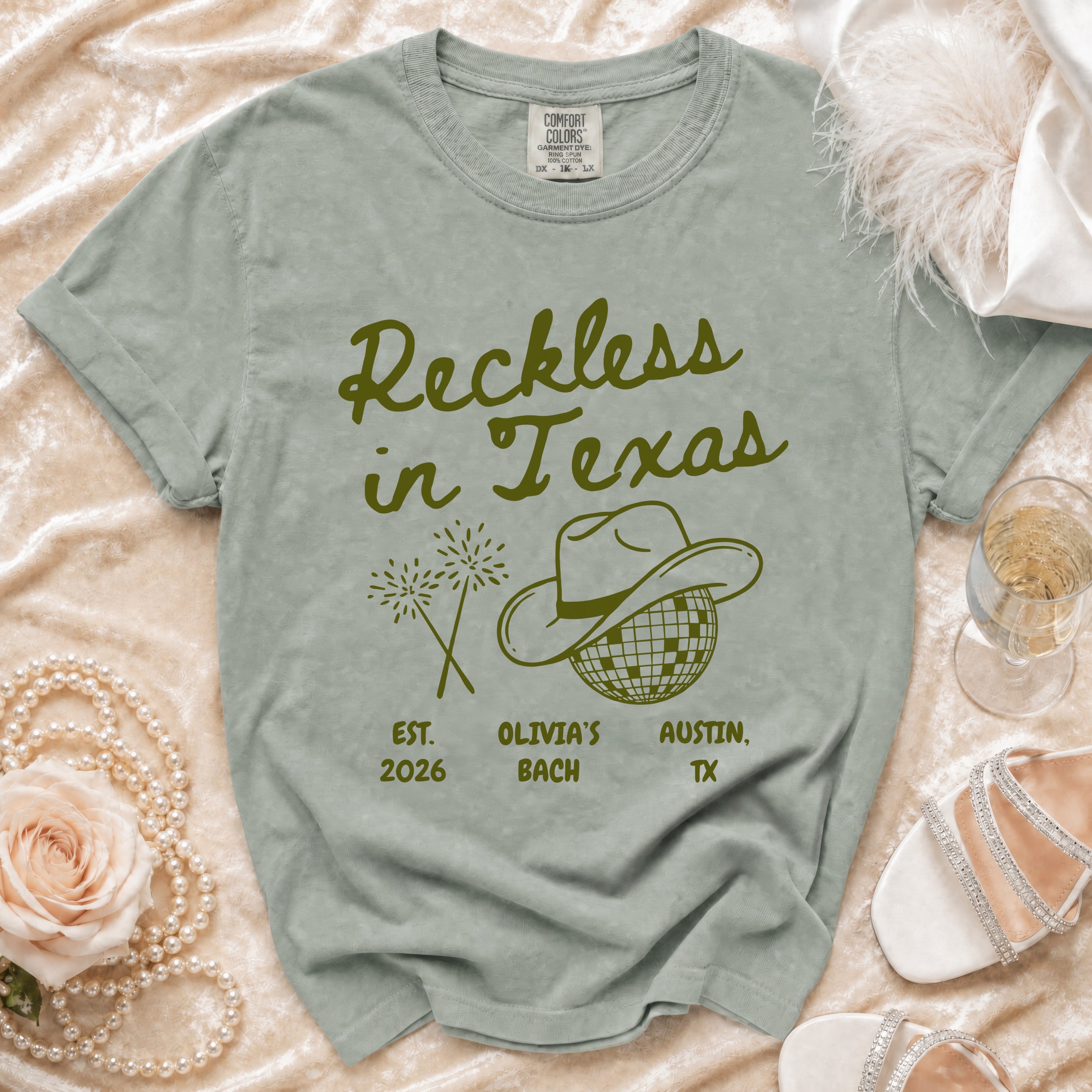Comfort Colors t-shirt with "Reckless in Texas" graphic and Austin, TX details.