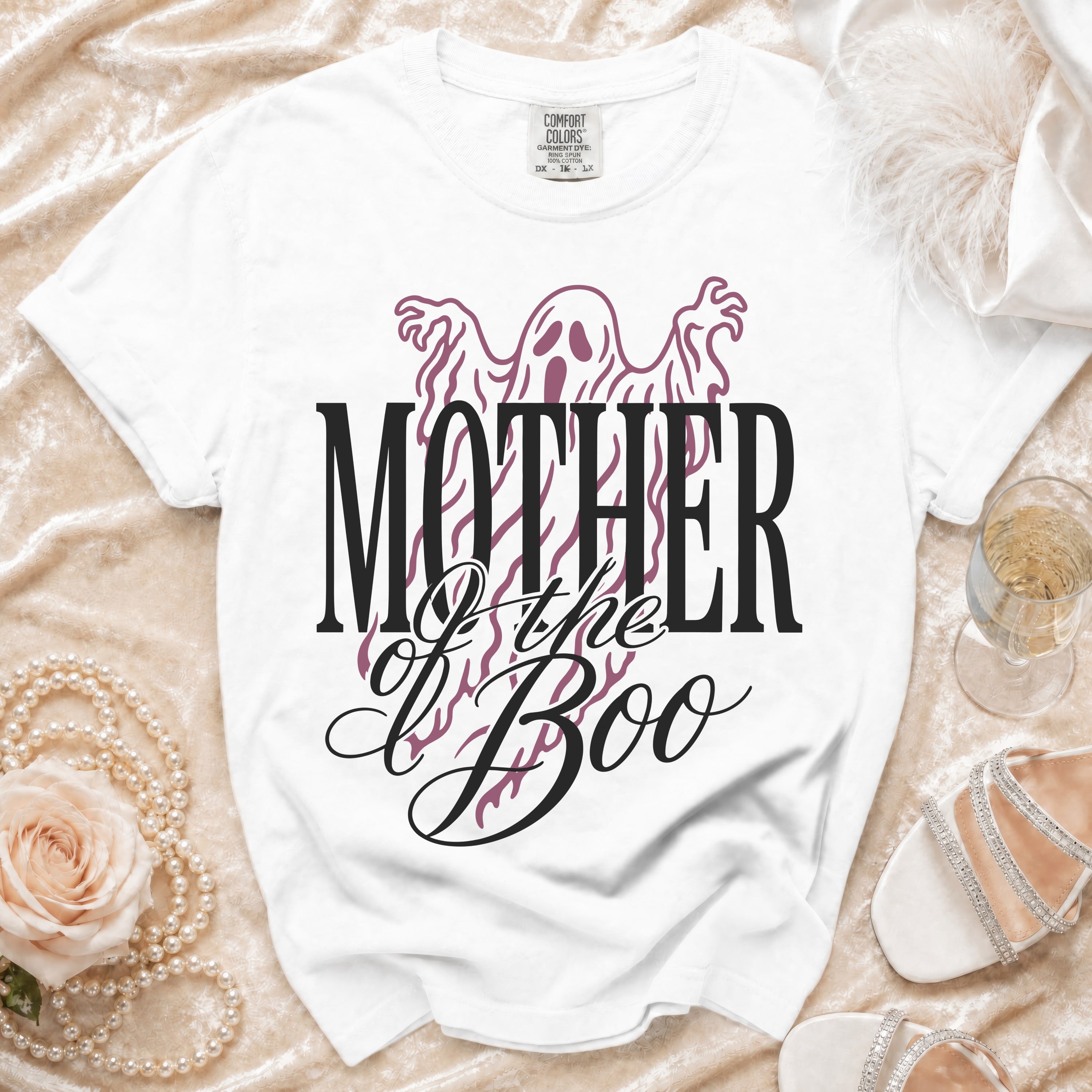 White t-shirt with purple ghost graphic and "Mother of the Boo" text.