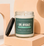 Glass candle with "Love, Officially Cheers To You Both" label, hand-poured soy wax.