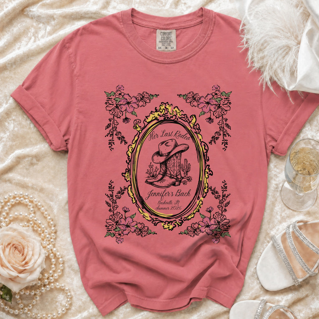 Pink t-shirt with "Her Last Rodeo" floral design and cowboy boot.