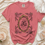 Pink t-shirt with "Her Last Rodeo" floral design and cowboy boot.
