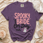 Purple t-shirt with "Spooky Bride On Duty" text and a ghost bride graphic.