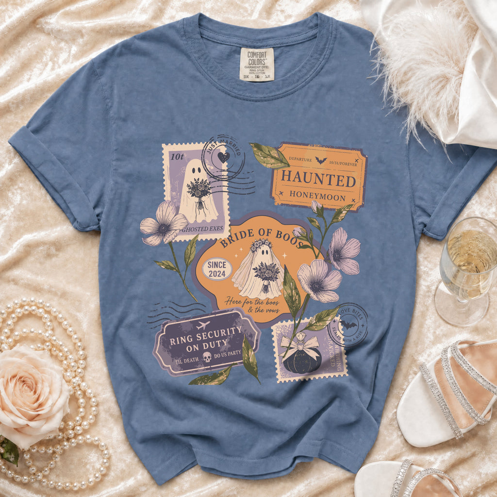 Blue t-shirt with vintage stamps featuring ghosts, flowers, and wedding/Halloween text.