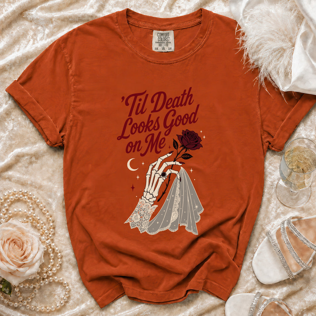 Orange t-shirt with skeleton hand, rose, and text: 'Til Death Looks Good on Me.