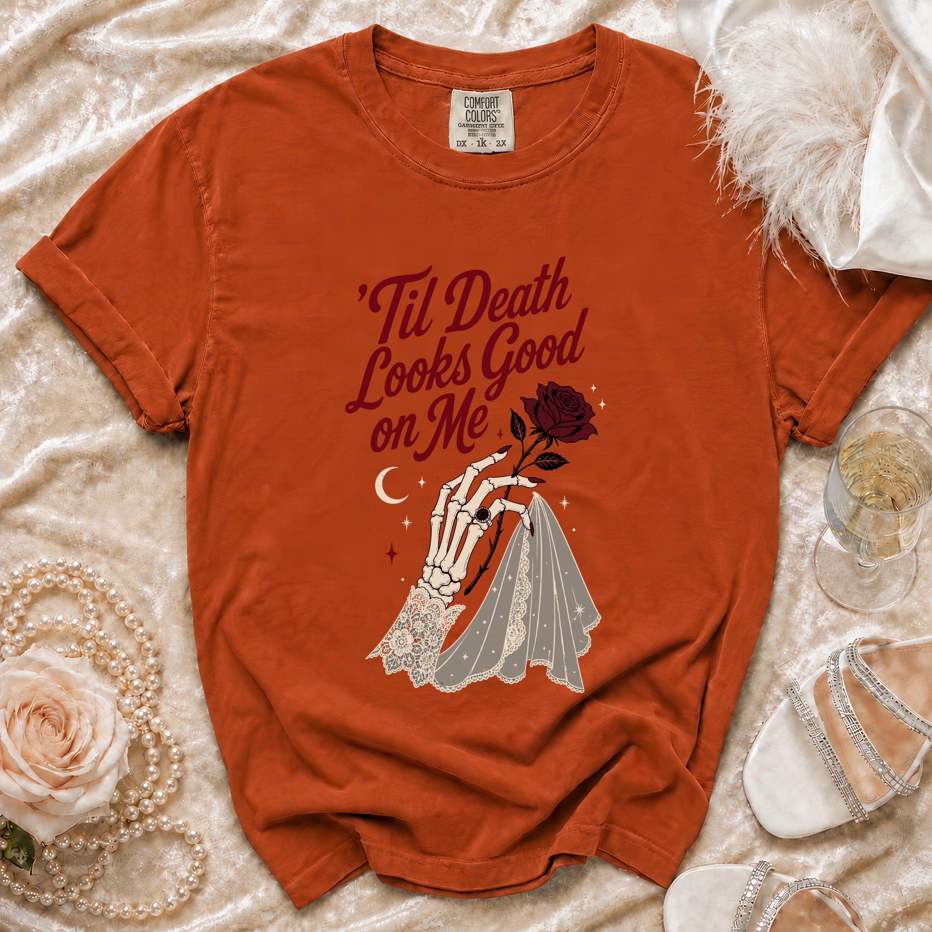 Orange t-shirt with skeleton hand, rose, and text: 'Til Death Looks Good on Me.