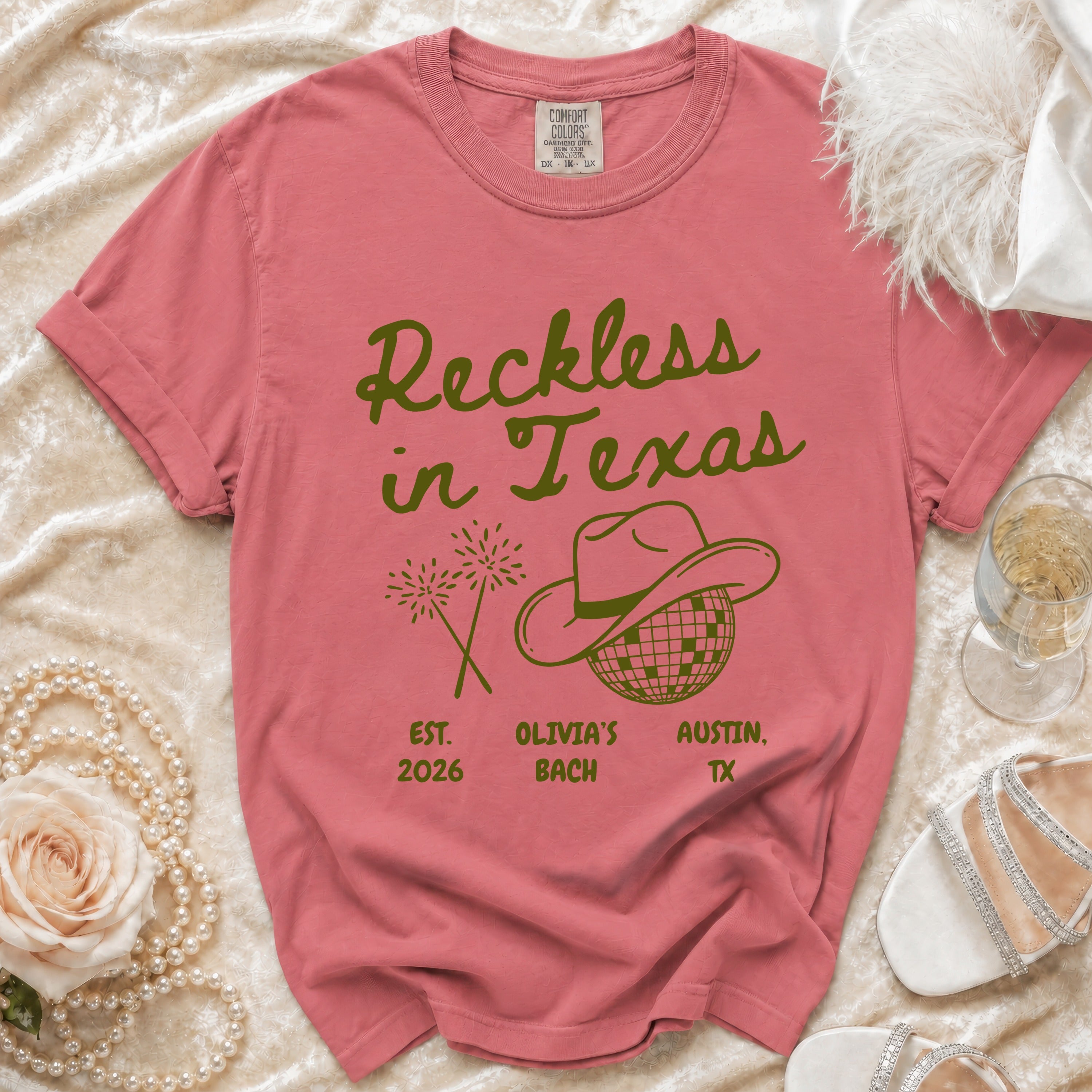 Coral t-shirt with "Reckless in Texas" and bachelorette details.