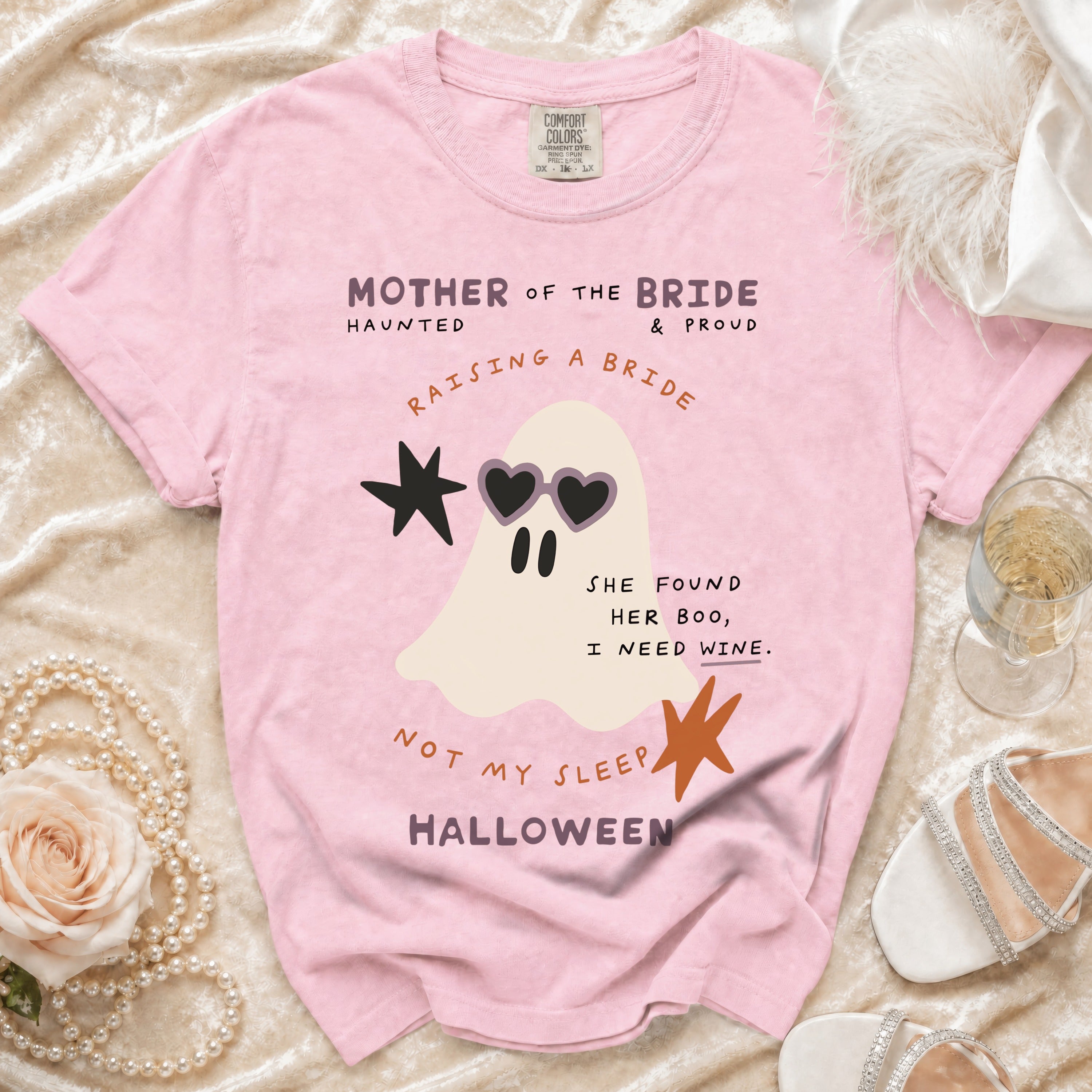 Pink t-shirt with ghost graphic saying "Mother of the Bride" and "Raising a Bride" for Halloween.