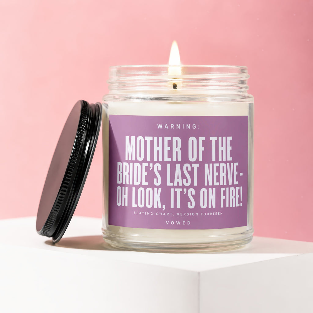 Candle with "Mother of the Bride's Last Nerve" text on purple label.