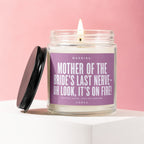 Candle with "Mother of the Bride's Last Nerve" text on purple label.