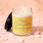Glass jar candle with "Main Character Nearlyweds" text and petal accents.