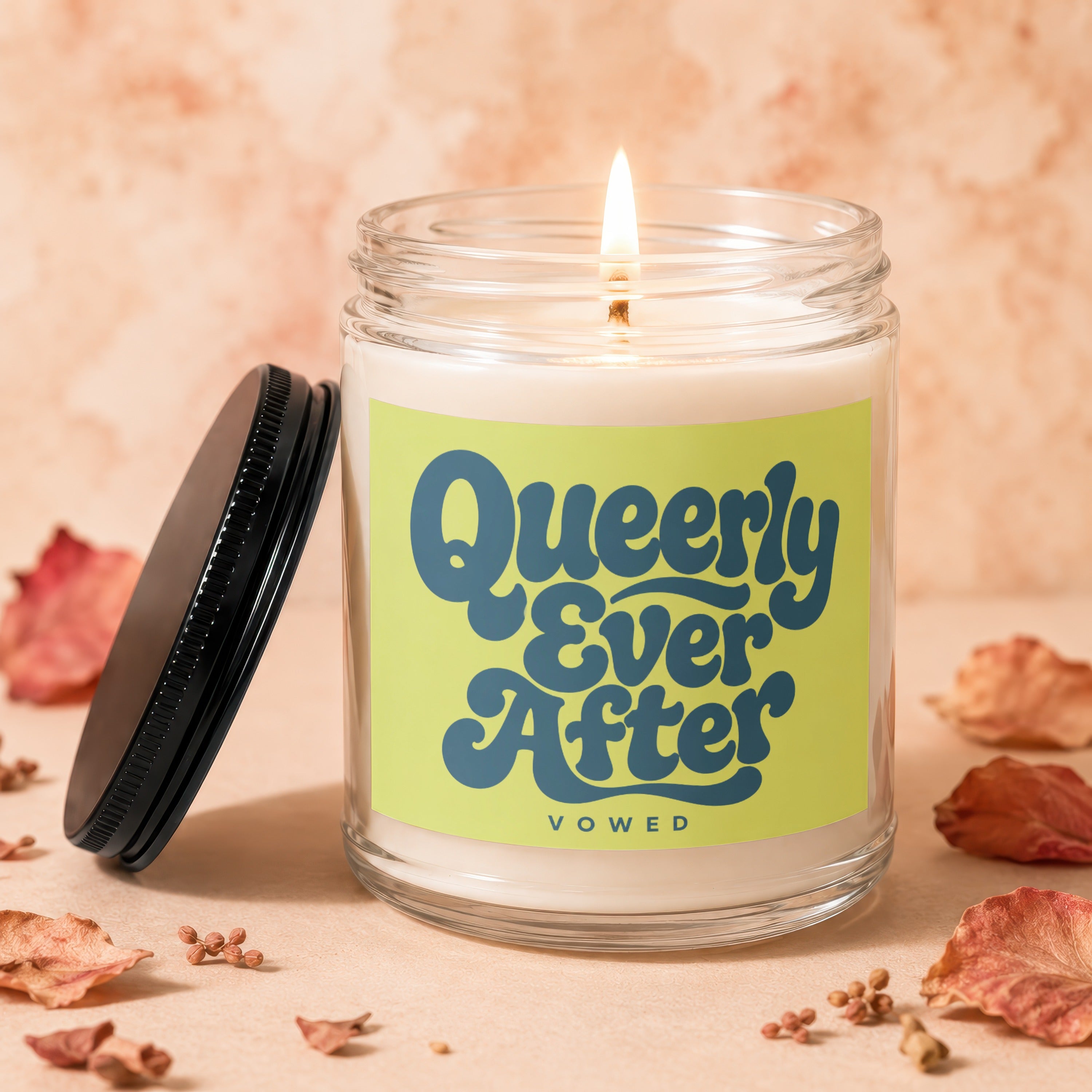 Glass candle with "Queerly Ever After VOWED" text on a lime green label.
