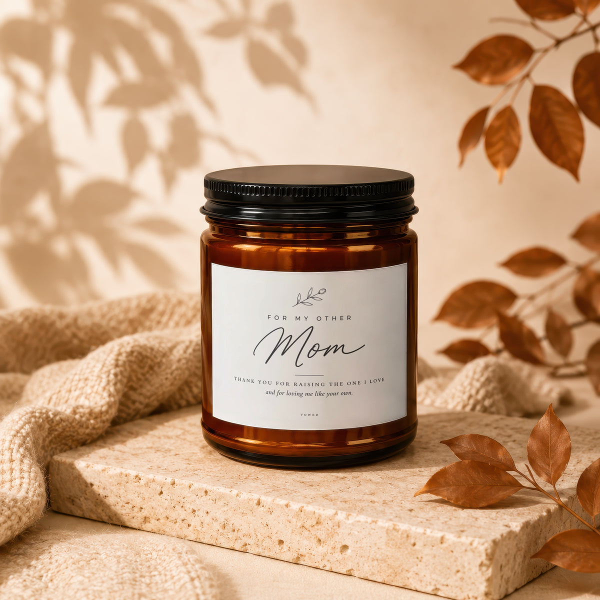 Amber jar candle with black lid, "Mom" and thank you message on label.
