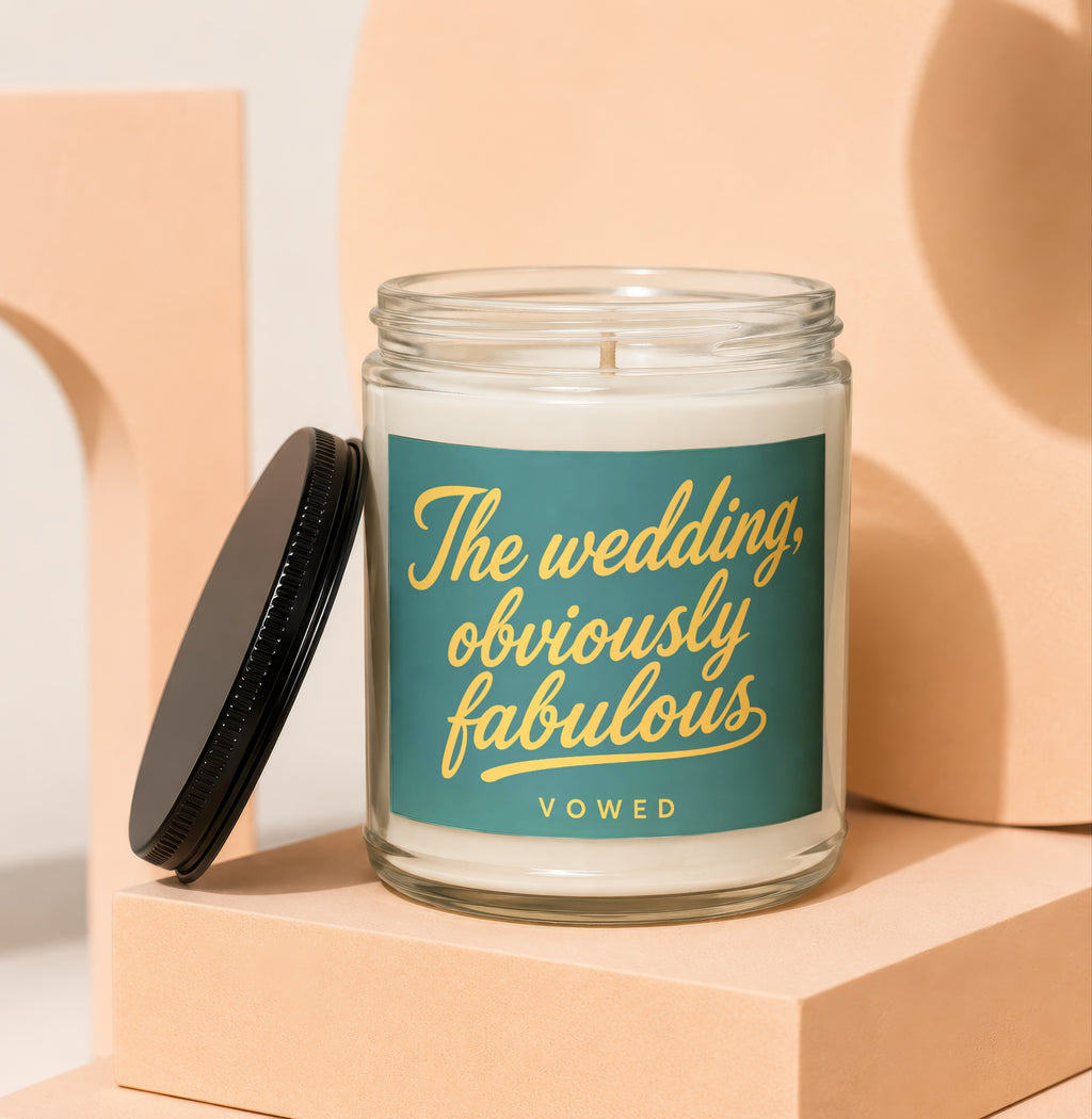 Glass candle with "The wedding, obviously fabulous" text and "VOWED" below.