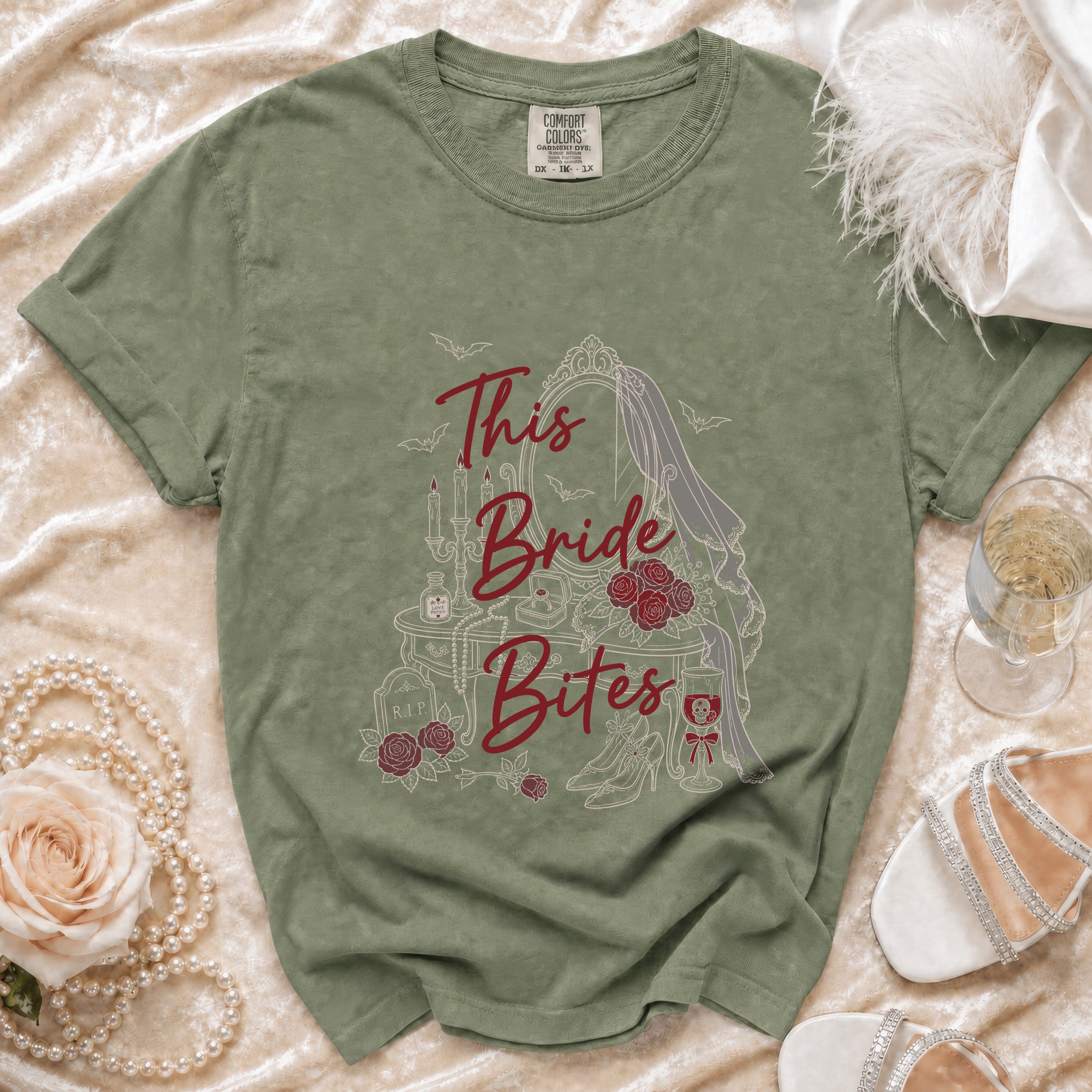Green t-shirt with "This Bride Bites" gothic bride graphic, bats, and roses.