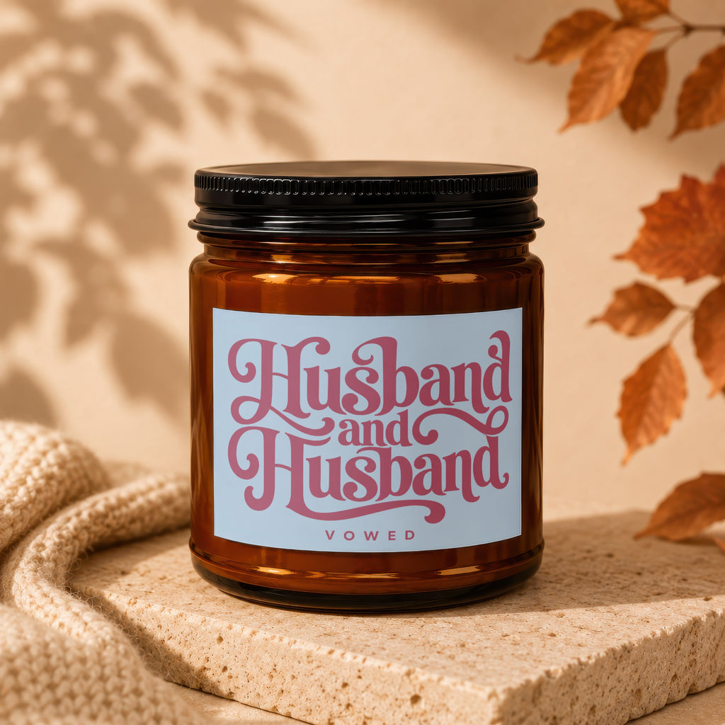 Amber candle with "Husband and Husband VOWED" text on label.