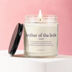 Glass candle with "brother of the bride noun" text description.
