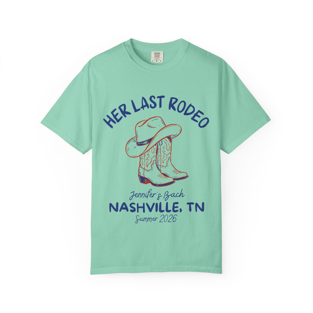 Teal t-shirt with cowboy boots and text "Her Last Rodeo" and bachelorette details.