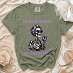Green t-shirt with purple text "MOTHER OF THE BRIDE, MY FAVORITE TITLE." and a skeleton graphic.