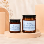 Two amber glass candles with black lids, labels read "Your Forever Was Worth the Chaos".