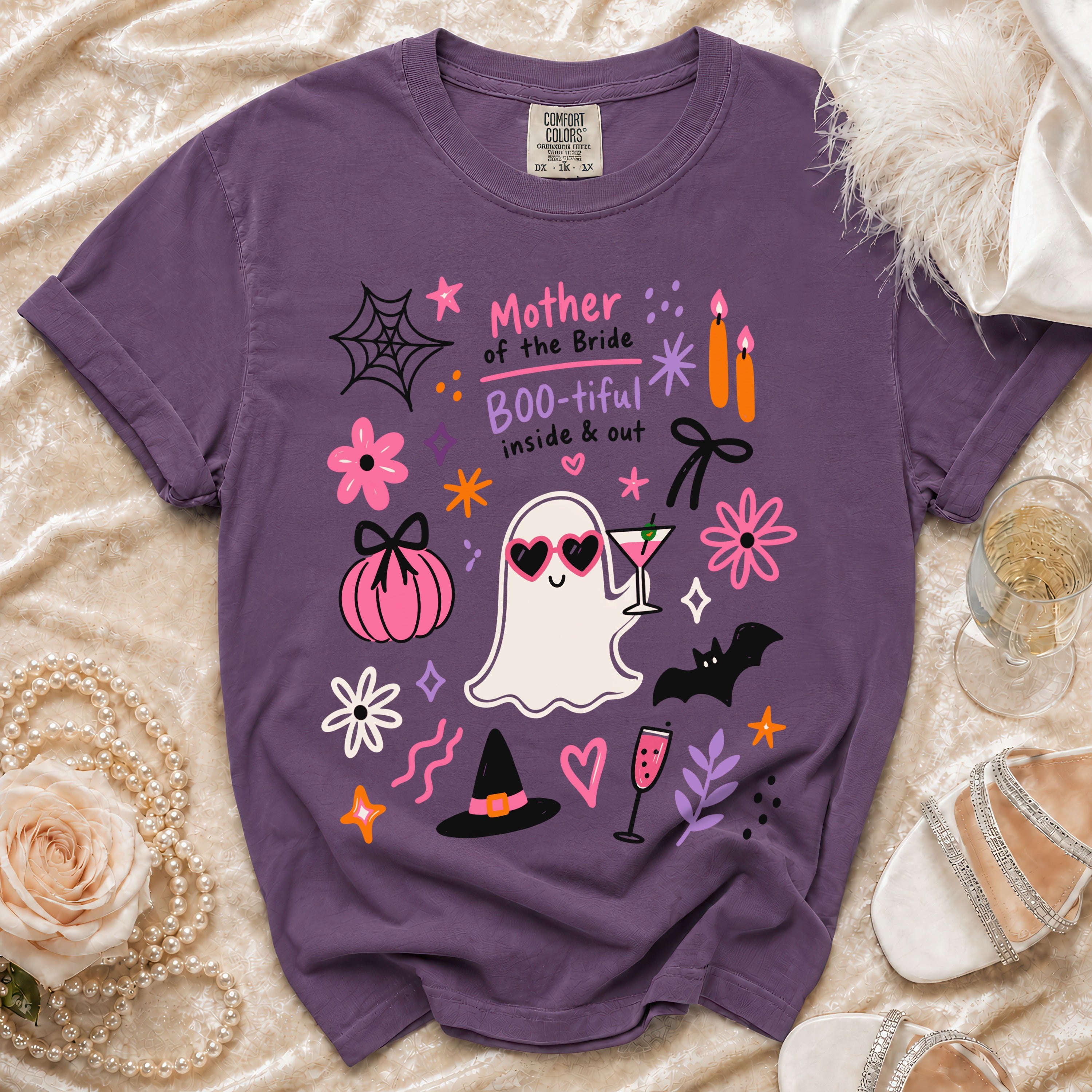 Purple t-shirt with "Mother of the Bride Boo-tiful inside & out" and Halloween graphics.