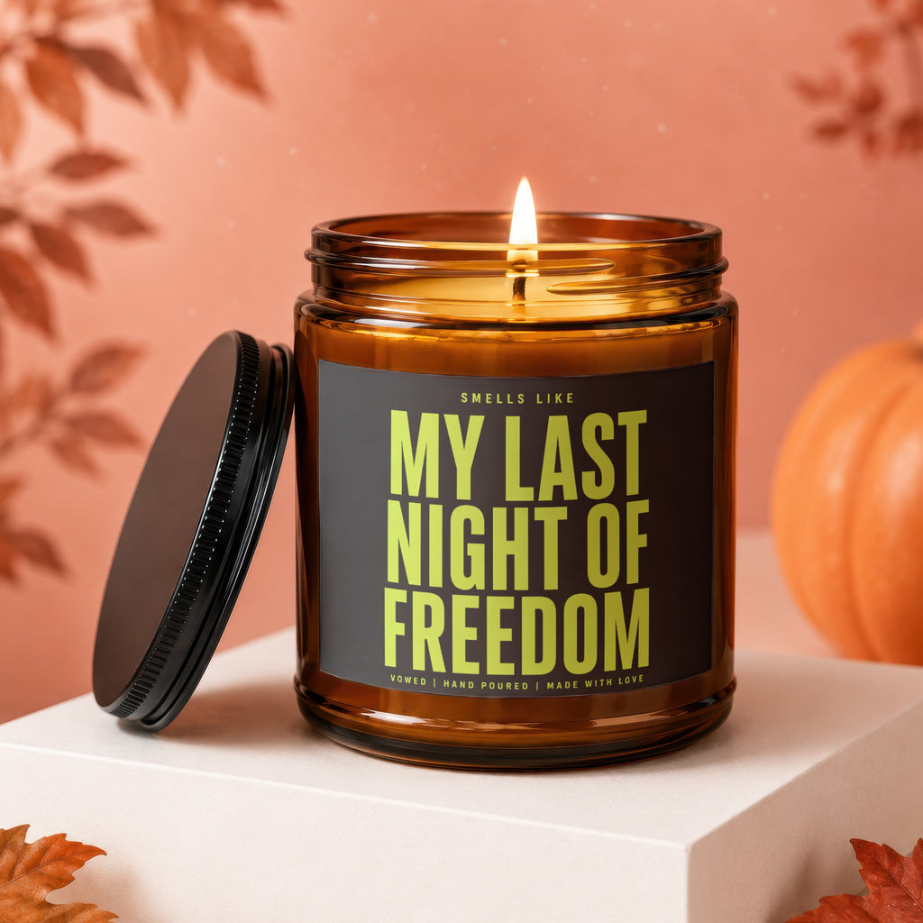 Amber jar candle with lit flame reads "My Last Night of Freedom".