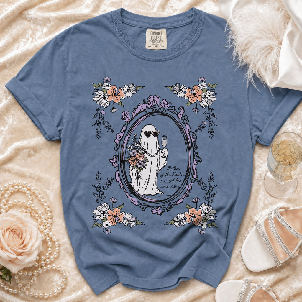 Blue t-shirt with ghost bride graphic and text, framed by flowers.