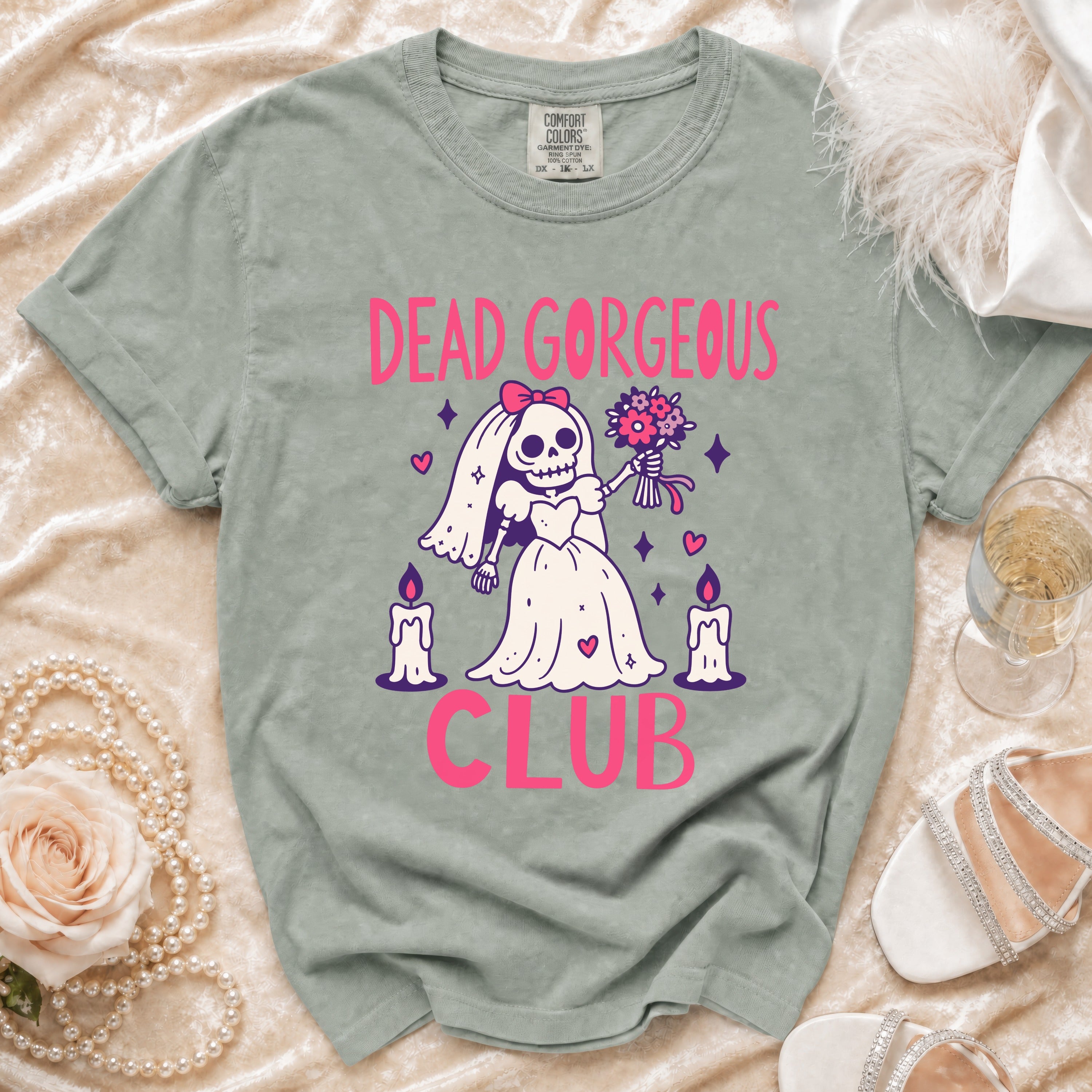 T-shirt with a skeleton bride graphic and text "DEAD GORGEOUS CLUB".