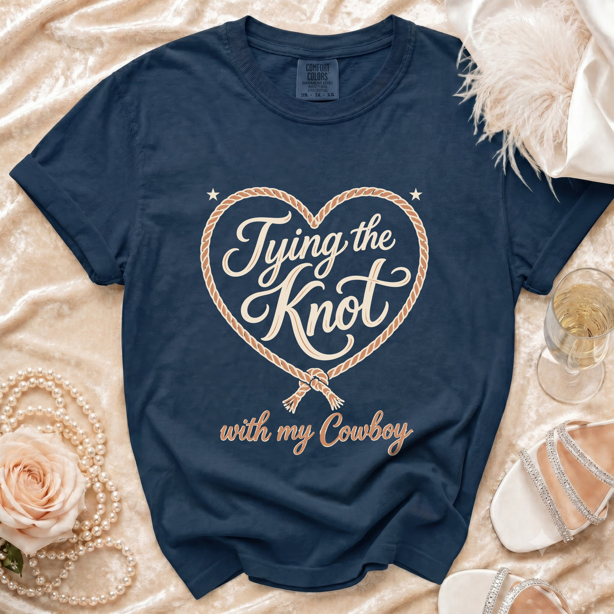 Navy t-shirt with "Tying the Knot with my Cowboy" printed inside a rope heart.